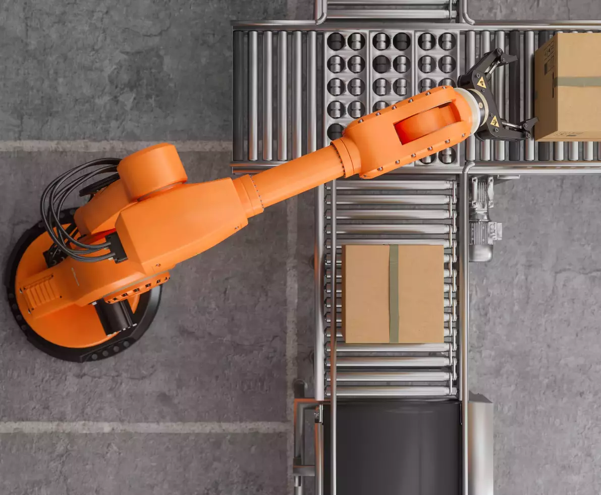 top view of robotic arm working in a factory